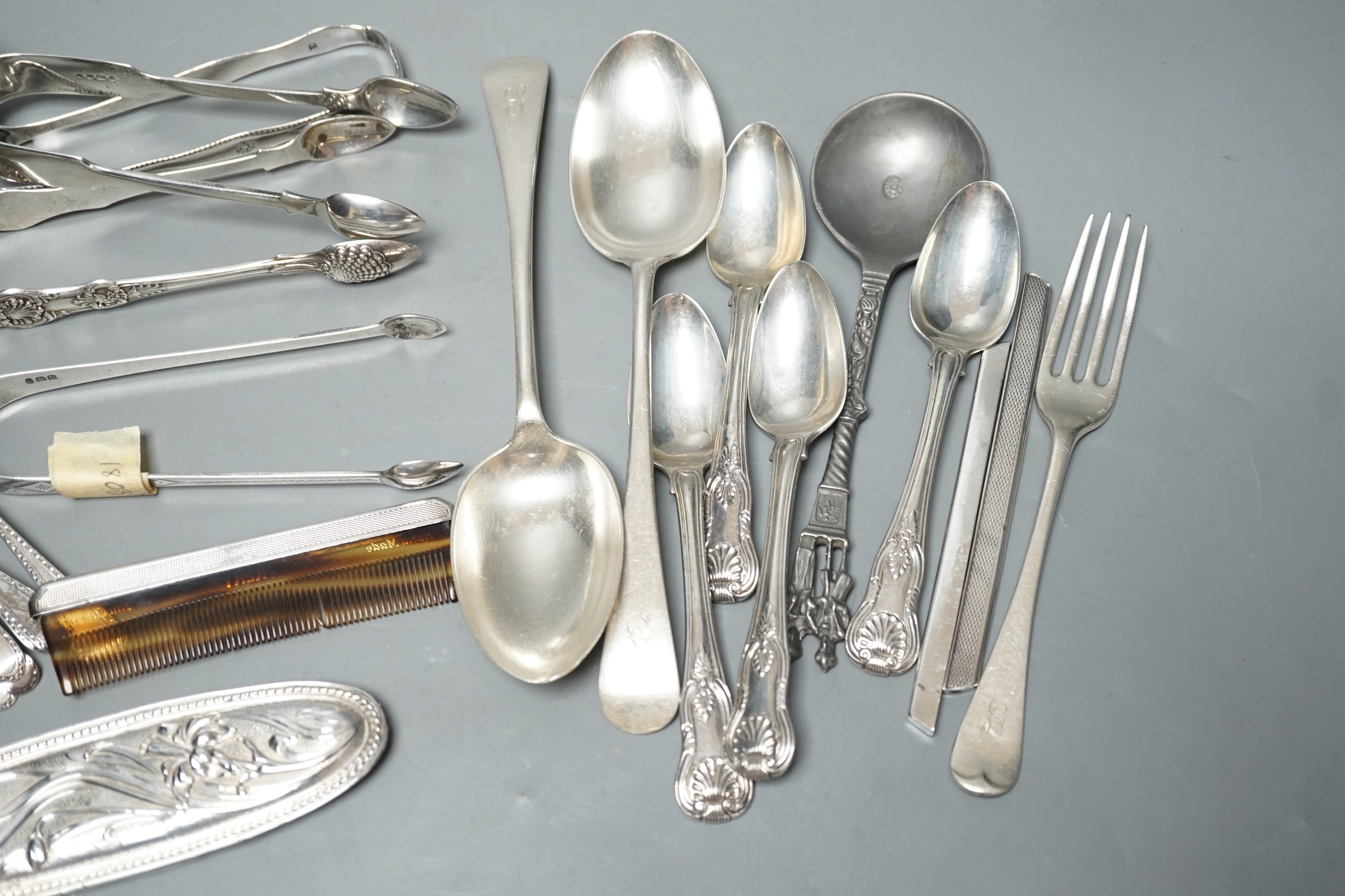 A small quantity of assorted silver flatware including a set of six teaspoons, by Peter, Ann & William Bateman, London, 1800, a pair of Victorian tablespoons, three pairs of silver sugar tongs etc. and a pewter spoon and